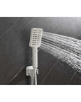 Handheld white shower head in use, providing flexible and directional water flow.