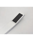 Close-up of Eclipse Series chrome handheld shower head with soft silicone nozzles