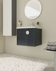 Angled view of 24 inch bathroom black vanity with fluted panel and integrated sink | Ace Decor
