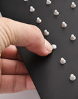 Close-up view of the silicone nozzles on the Lorton 12" black rain shower head.