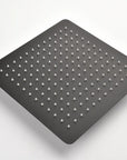 Lorton 12" black rain shower head showing its nozzles and square design.