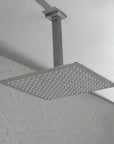 Side-angle bathroom scene with the Lorton brushed nickel 12" rain shower head mounted from above.
