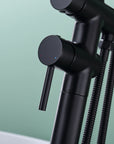 Close-up of handle on Freestanding Black Tub Faucet with Handheld Shower, with hot and cold indicators.