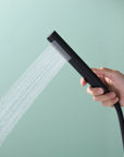 Handheld shower of Freestanding Black Tub Faucet, ergonomic design providing strong and even water flow.
