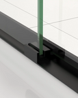 Bottom guide block close-up of 60 x 70 black framed sliding shower door.