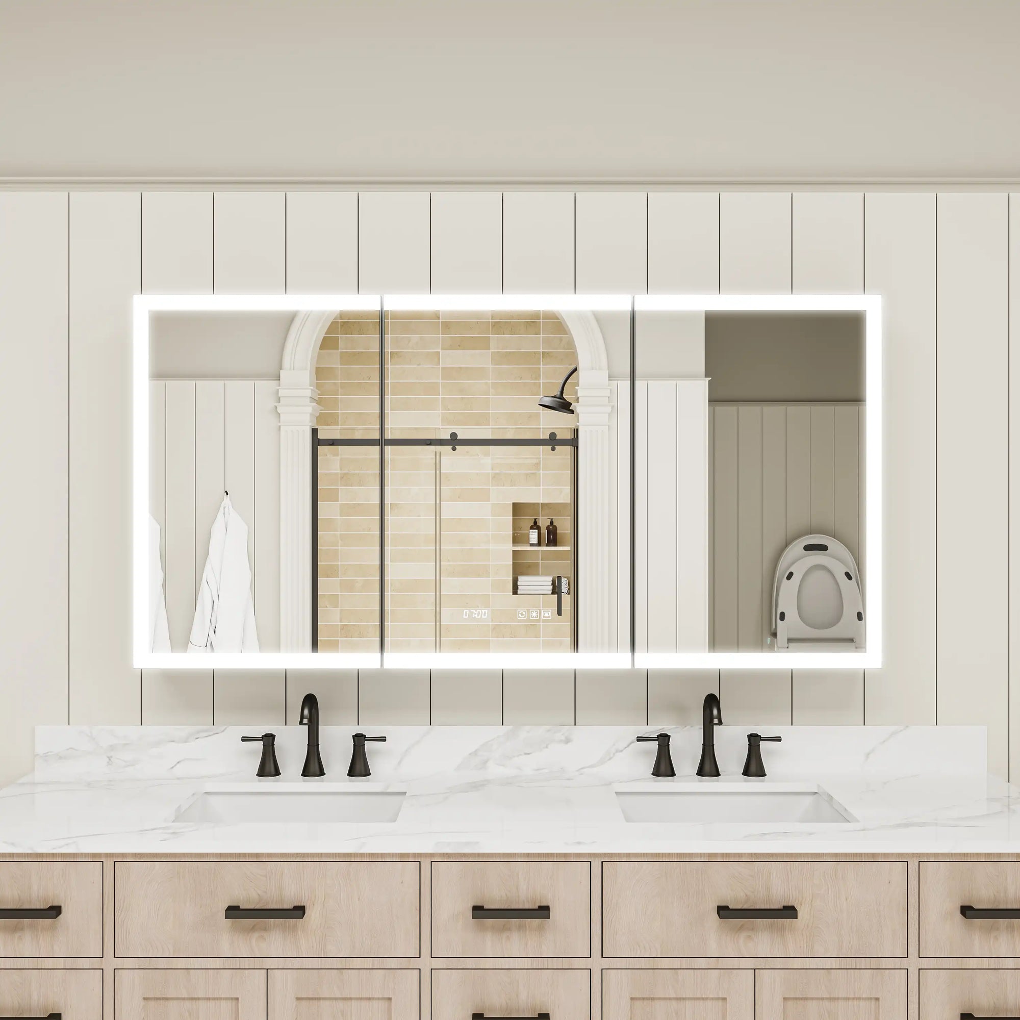 Three-door lighted medicine cabinet installed in double sink bathroom