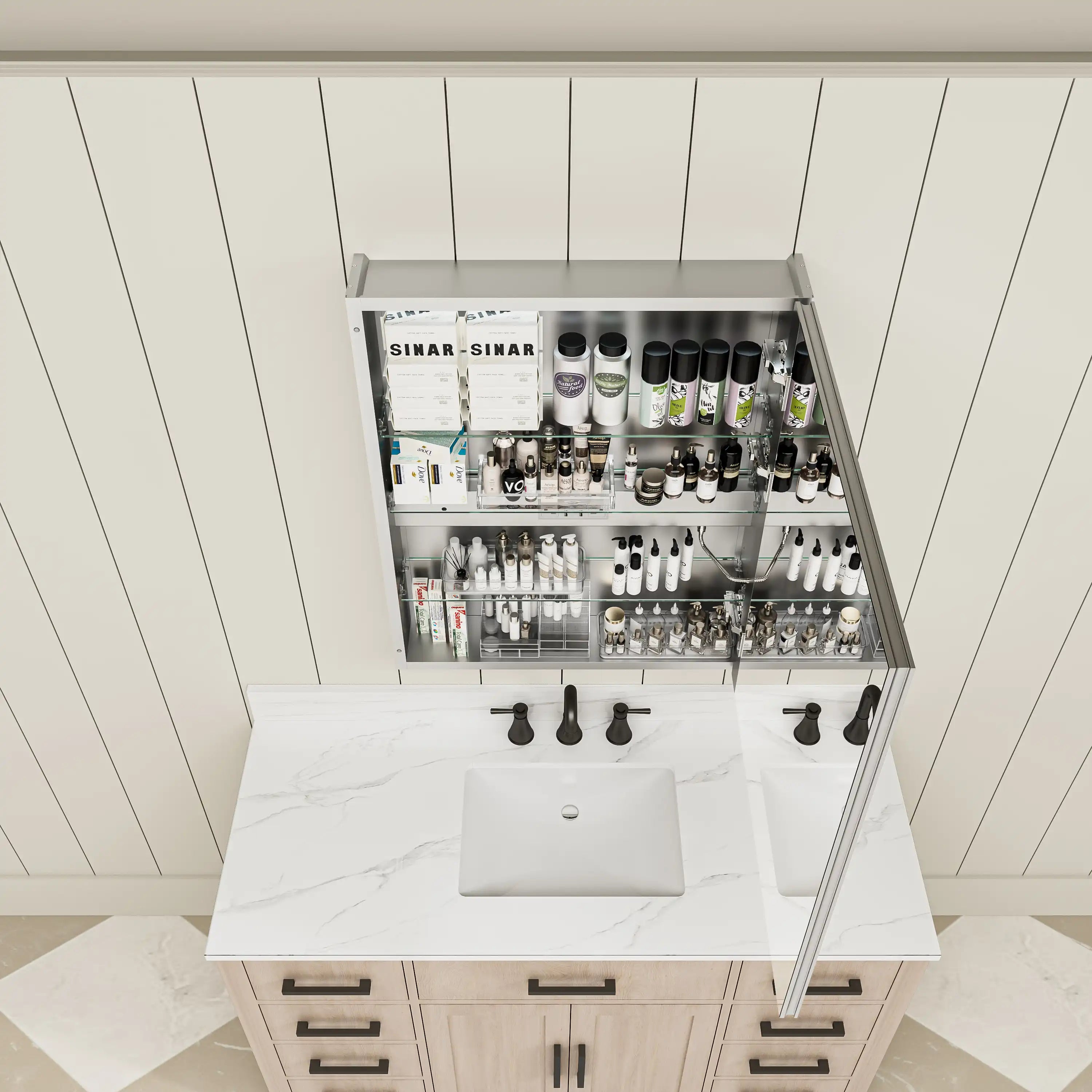 Top view of single-door medicine cabinet half open showing layered storage.