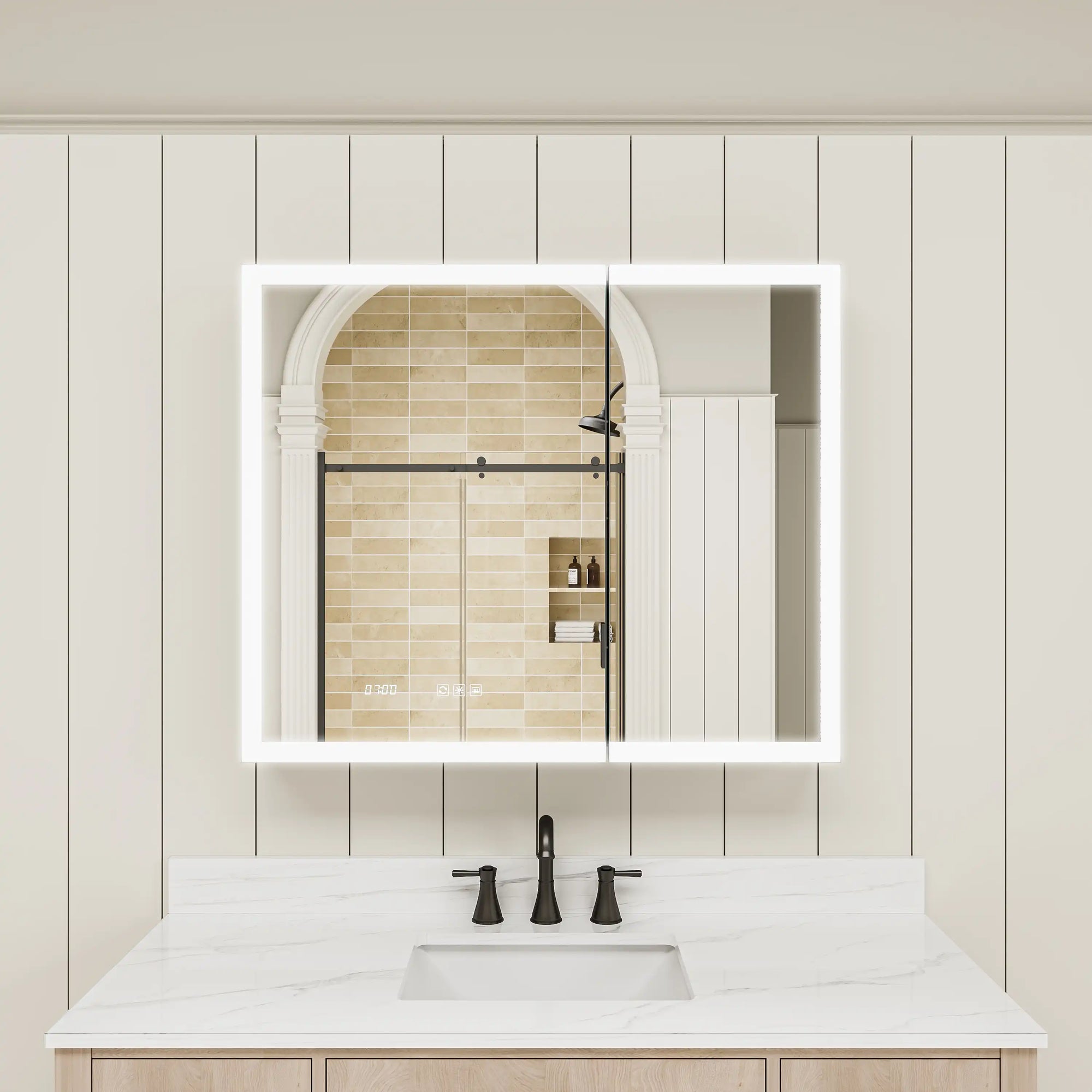 Double-door LED medicine cabinet with lights on above bathroom sink.