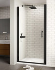 Zerra Series black semi-frameless pivot shower door in a modern white tile bathroom.