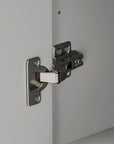 Stainless steel hinge of the grey linen cabinet door.
