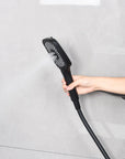 Matte black hand shower using the focused center spray mode.
