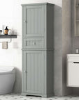 Norrin 67.3 inch grey tall narrow bathroom storage cabinet with closed doors and drawer in modern bathroom interior.