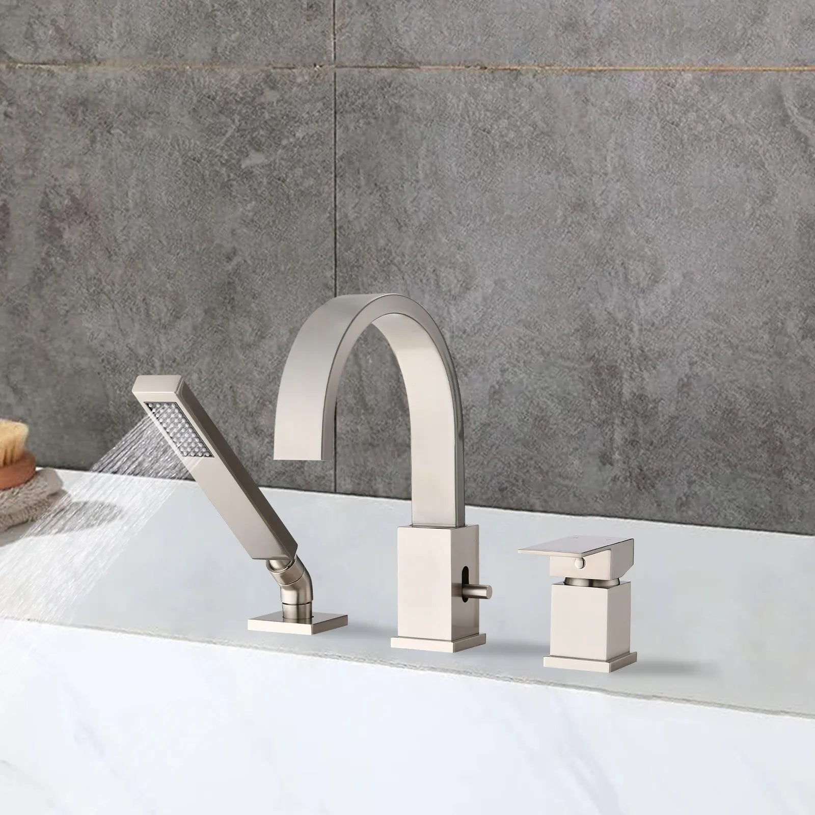 FLUNIX Brushed Nickel Waterfall Roman Tub Faucet Set installed on bathtub, handheld shower spraying water.