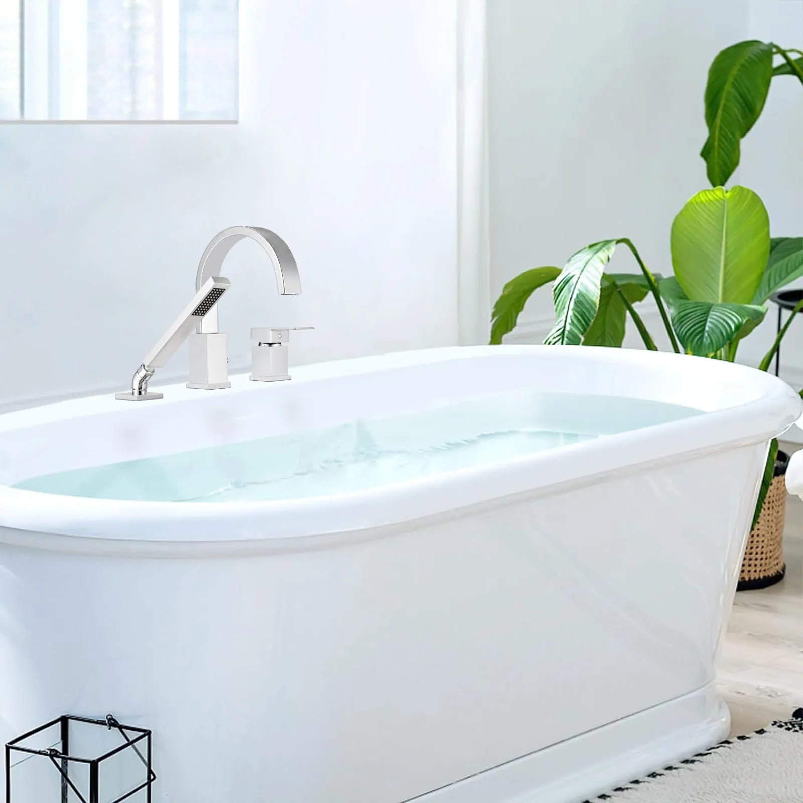 FLUNIX Chrome Waterfall Roman Tub Faucet installed on freestanding bathtub, modern bathroom design with natural light.