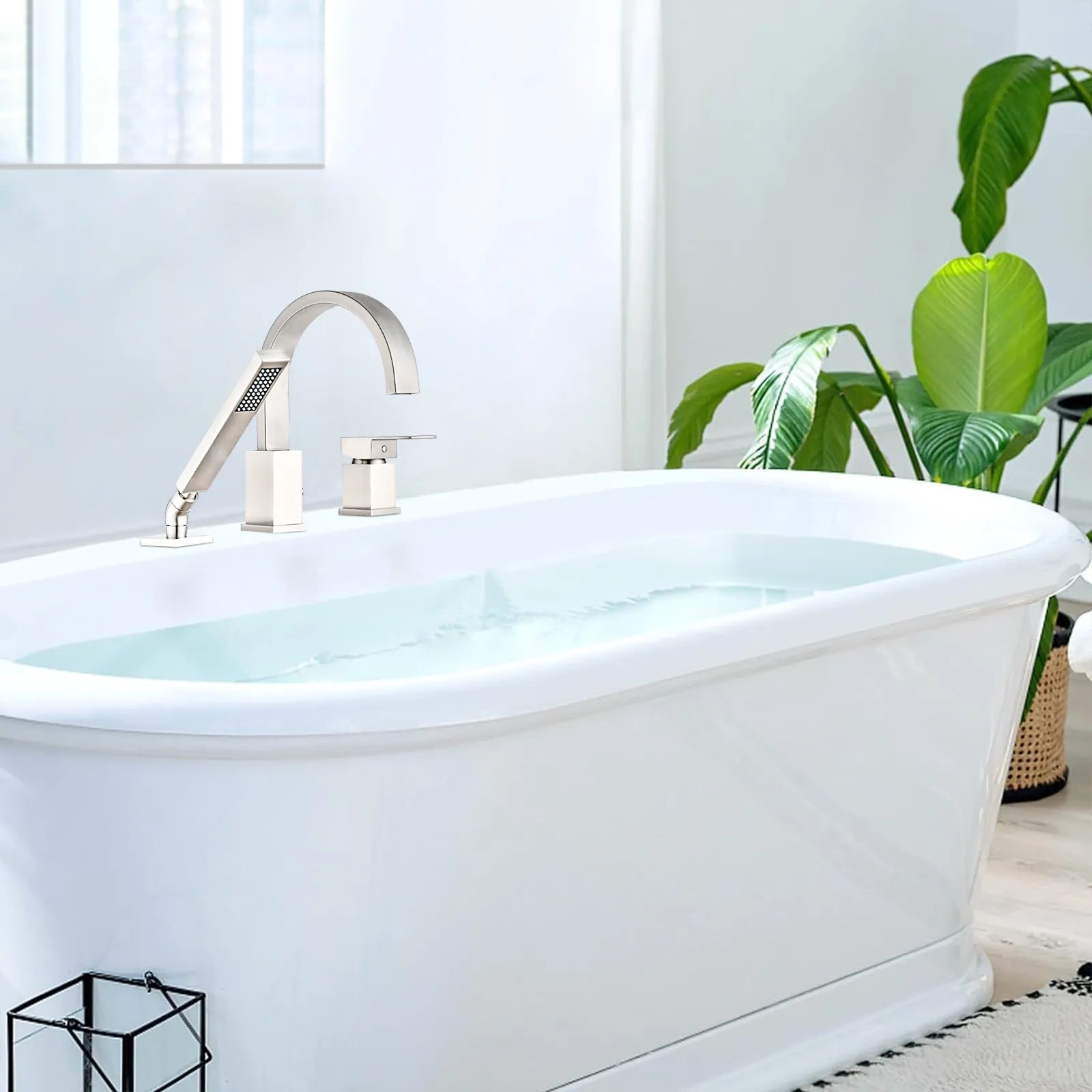 FLUNIX Brushed Nickel Waterfall Roman Tub Faucet Set installed on freestanding bathtub.