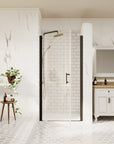 Matte black framed pivot shower door closed in a modern white bathroom | Ace Decor