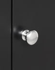 Metal door handle close-up on Norrin 67.3 inch black bathroom storage cabinet.