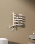 White heated towel rail radiator holding two brown towels, ideal for modern bathroom spaces | Ace Decor