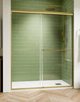 Front view of the 60 x 72 framed shower door with brushed-gold frame and single handle installed in a green-tile bathroom | Ace Decor