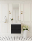 24" black single sink bathroom vanity with a wall-mounted design in a bright modern bathroom.