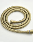 AURELIA Brushed Gold Wall-Mounted Bathtub Faucet flexible shower hose detail.