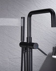 Black Freestanding Tub Faucet with handheld shower spraying water.