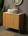 Ivory Astra Series 18" Oval Sculpted Resin Stone Vessel Basin styled on modern wooden vanity, angled view | ACE DECOR