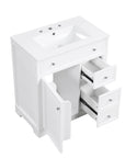 30 inch white bathroom vanity with cabinet door and two drawers open to display interior storage.