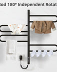 Arvia Series black electric towel rack with rotating bars drying baby clothes, jacket, bath towel, and socks.