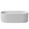 Modern oval solid surface bathtub with fluted exterior design in matte white finish, offering a sleek and contemporary look for luxury bathrooms | Ace Decor