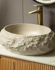 Close-up of sculpted rim and stone texture of Astra Series 18" Oval Sculpted Resin Stone Vessel Basin in ivory | ACE DECOR