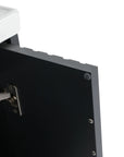 Interior detail of modern bathroom floating vanity showing soft-close hinge and clean edge finish.