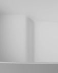 Close-up of the built-in seat in the 51" white Japanese style soaking tub, highlighting its seamless, ergonomic design.
