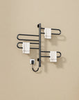 17 x 31 electric towel rack warmer in matte black with towels hanging on four curved bars | Ace Decor