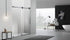 Minimalist bathroom featuring a matte black frameless glass sliding shower door installation