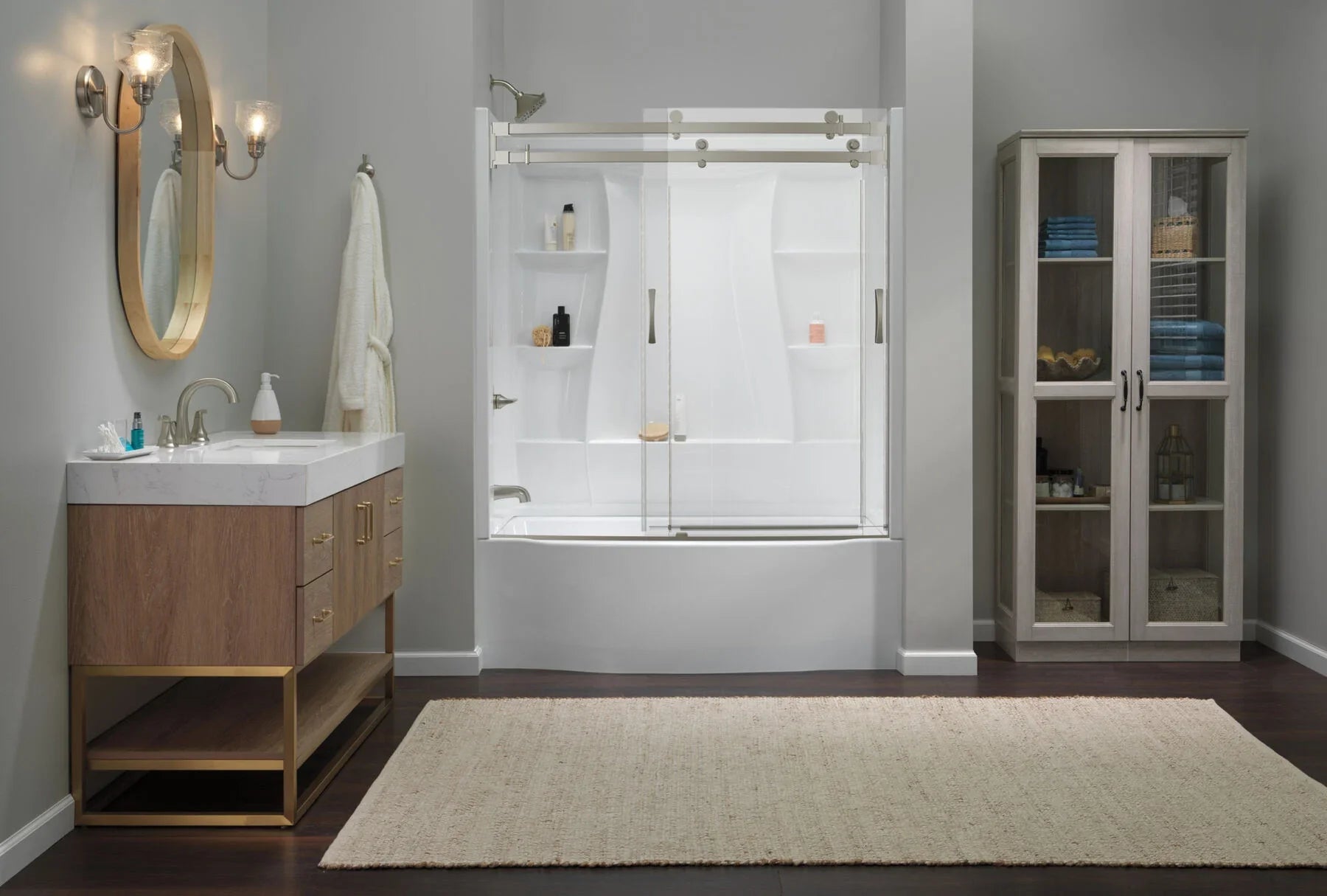 A modern bathroom with an all-white bathtub and a clear glass sliding door | ACE DECOR