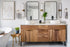 A stylish, modern bathroom featuring a wood-accented freestanding vanity unit with dual vessel sinks and black hardware details. | ACE DECOR