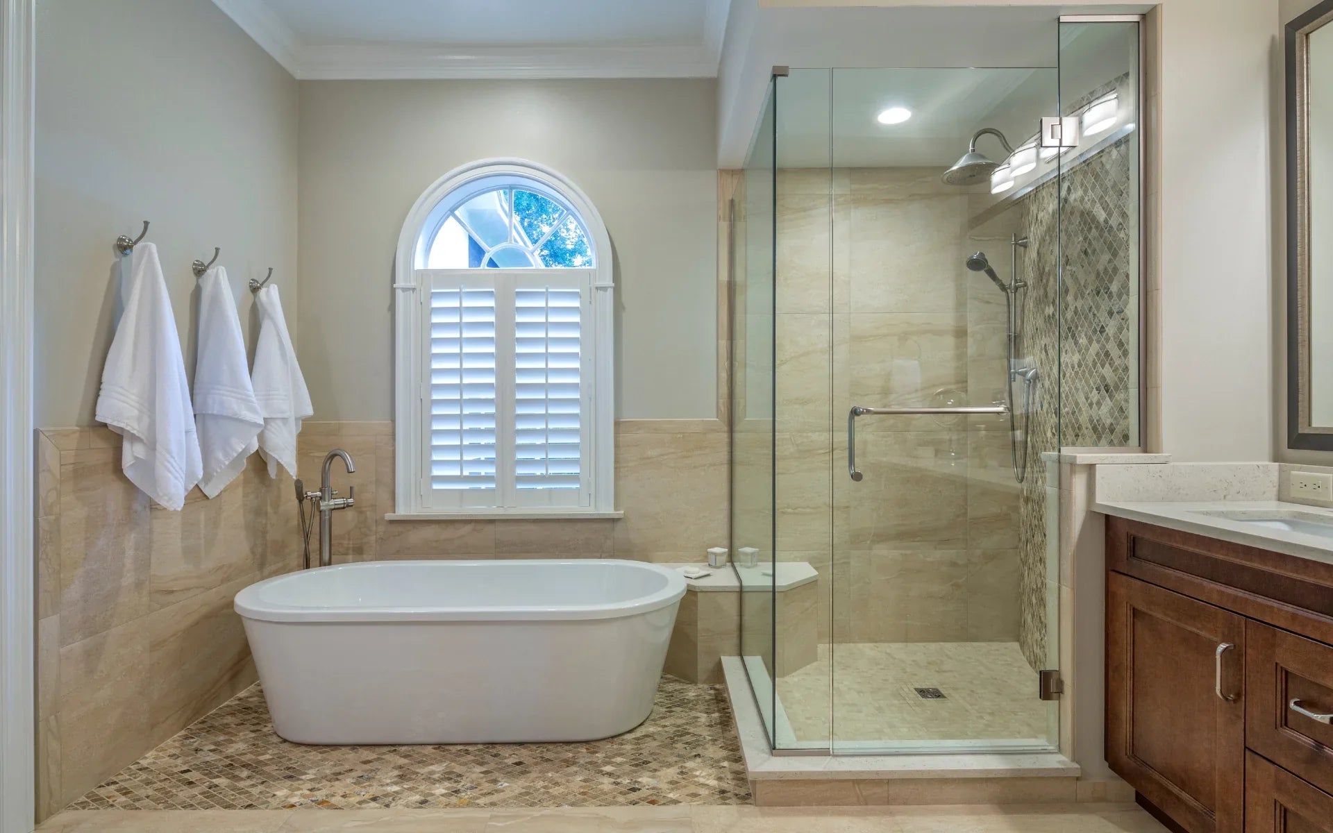 a luxurious bathroom featuring a frameless shower door, a freestanding bathtub, and elegant tilework for a sophisticated spa-like feel. | ACE DECOR