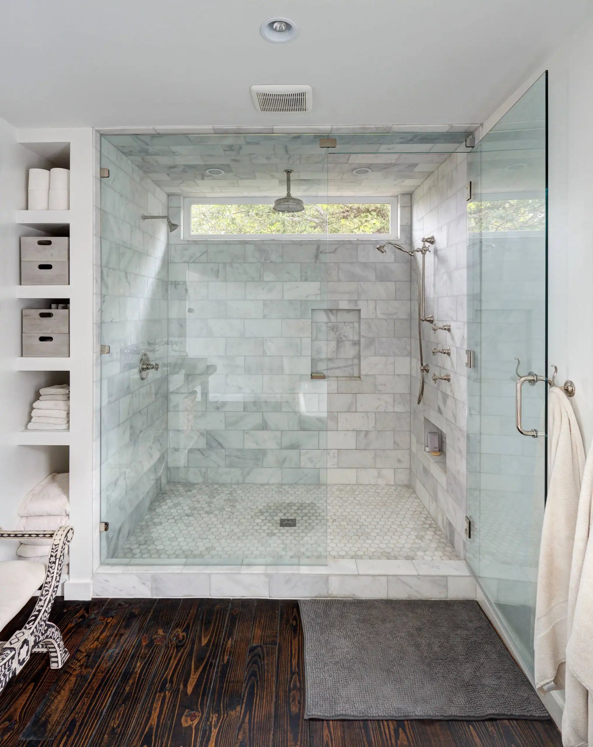 Spacious glass-enclosed marble shower with rainfall and handheld system | types of showers | Ace Decor