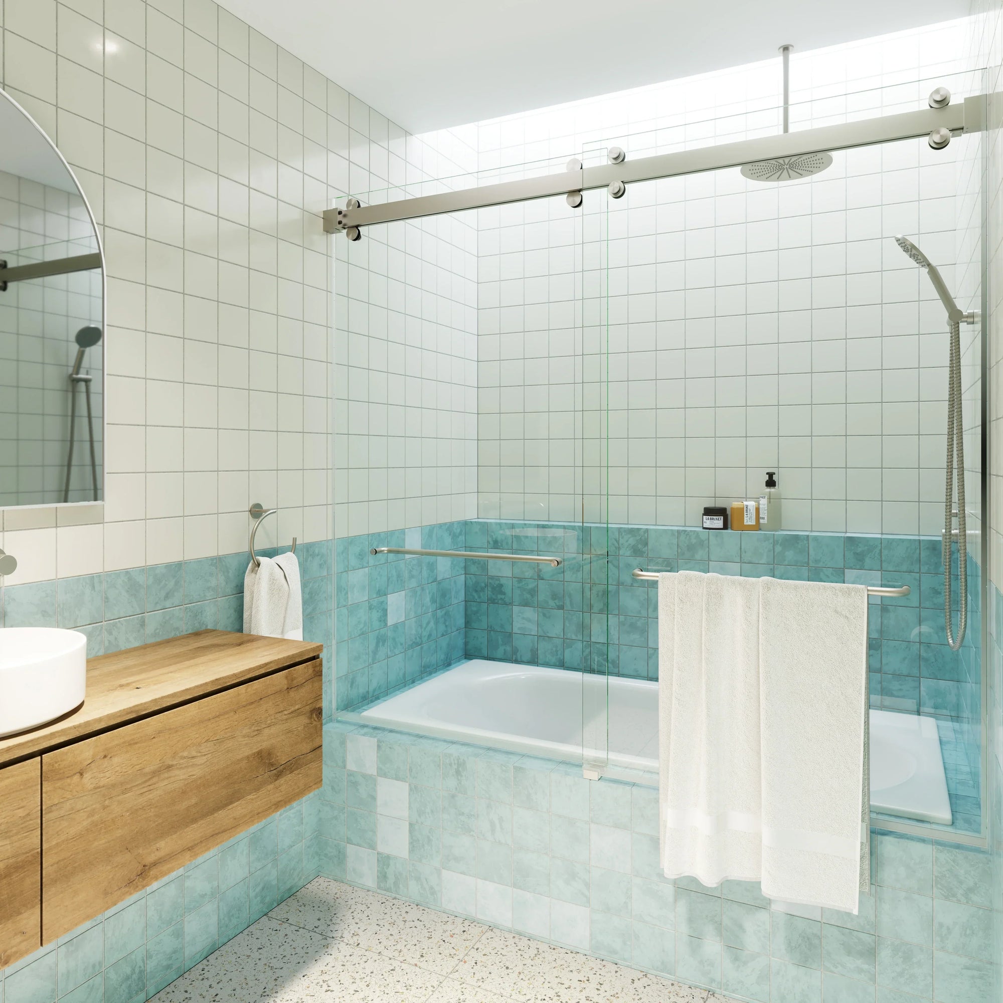 A modern bathroom with light blue tiles and a glass bathtub door | ACE DECOR