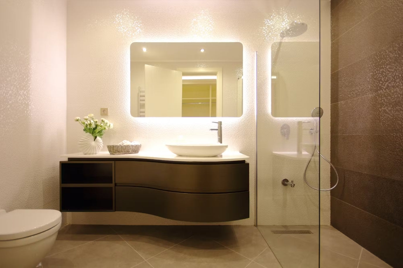 a modern design with an LED bathroom vanity light integrated around the mirror, providing sleek, soft illumination. | ACE DECOR