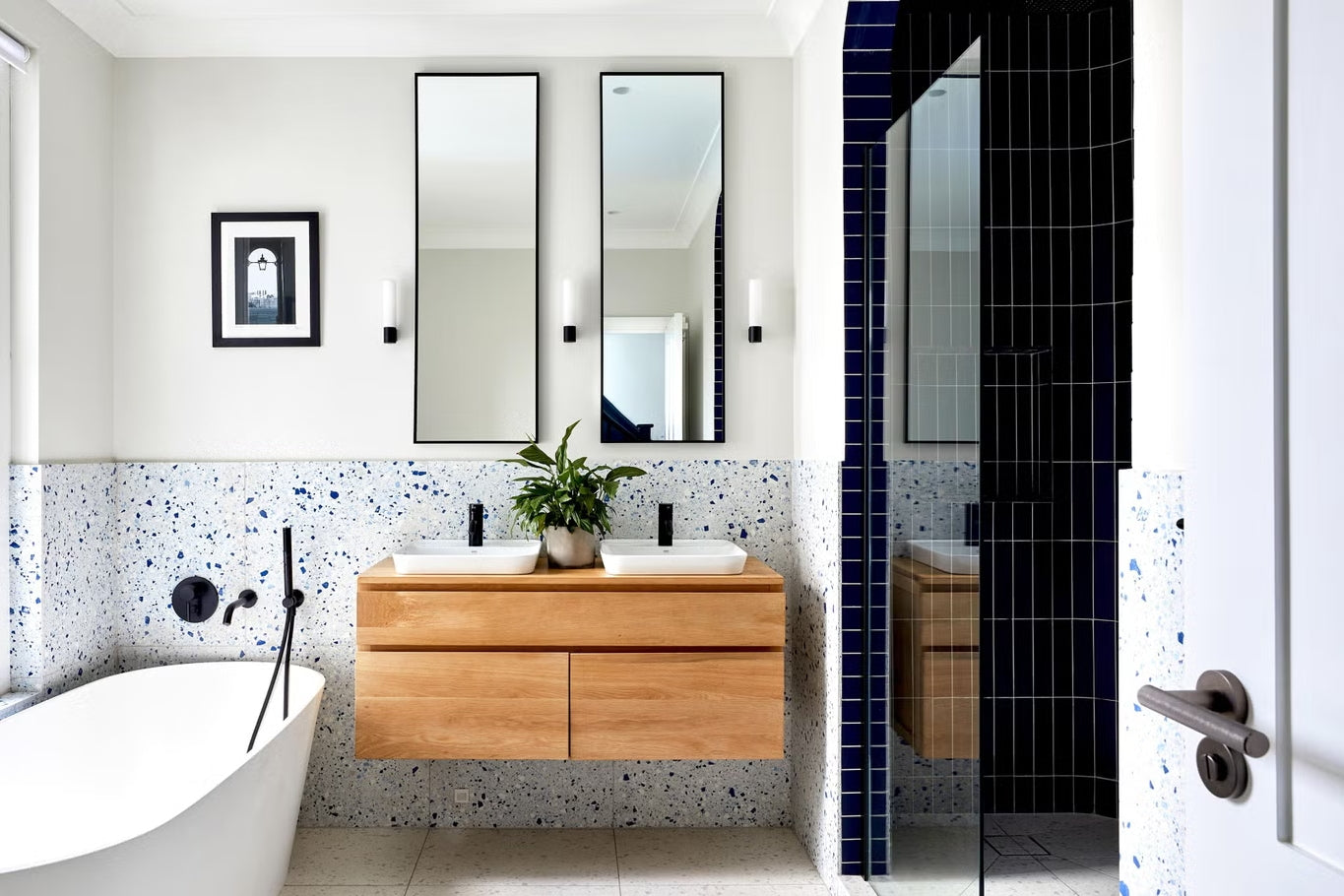 a sleek floating bathroom vanity with sink, paired with modern black fixtures and a minimalist design. | ACE DECOR