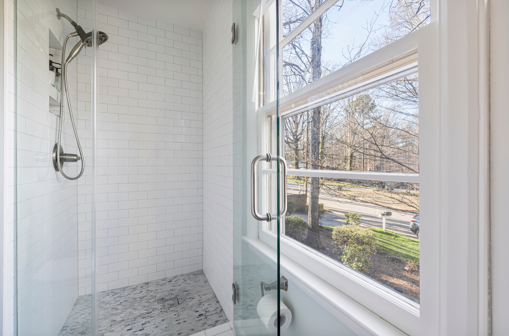 framed shower door in a bright bathroom | ACE DECOR