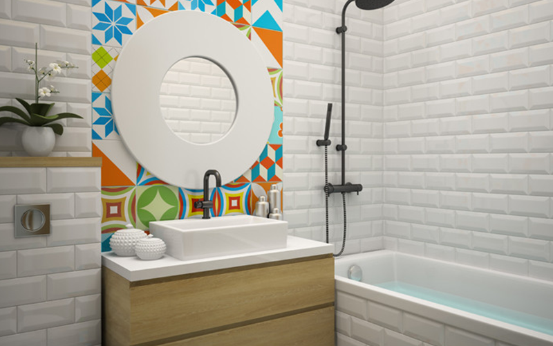 a unique round bathroom mirror with a bold white frame, set against colorful geometric tiles, adding a vibrant and stylish touch to the space. | ACE DECOR