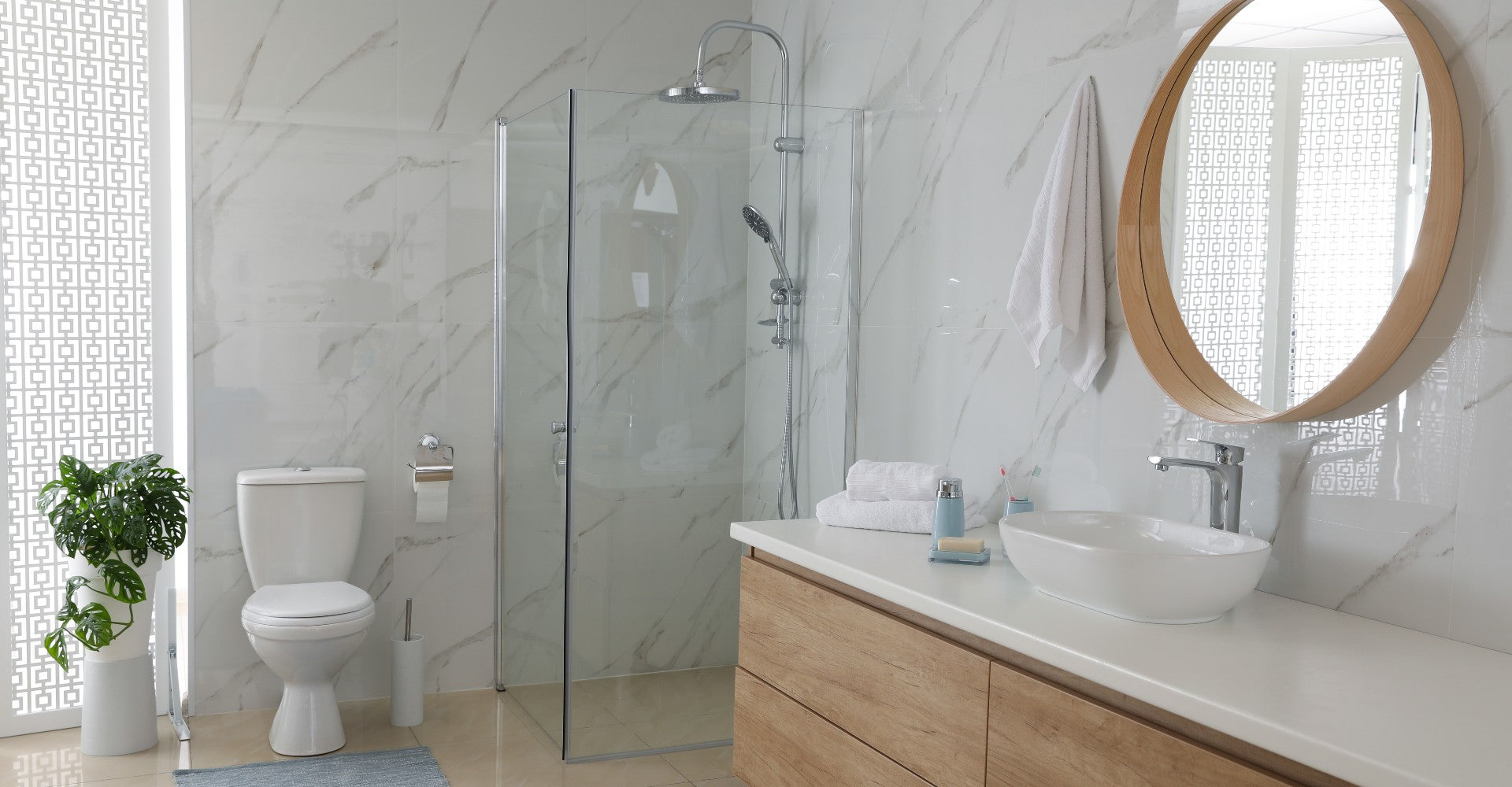 a stylish, modern bathroom featuring a semi-frameless shower door with sleek glass panels and chrome accents. | ACE DECOR
