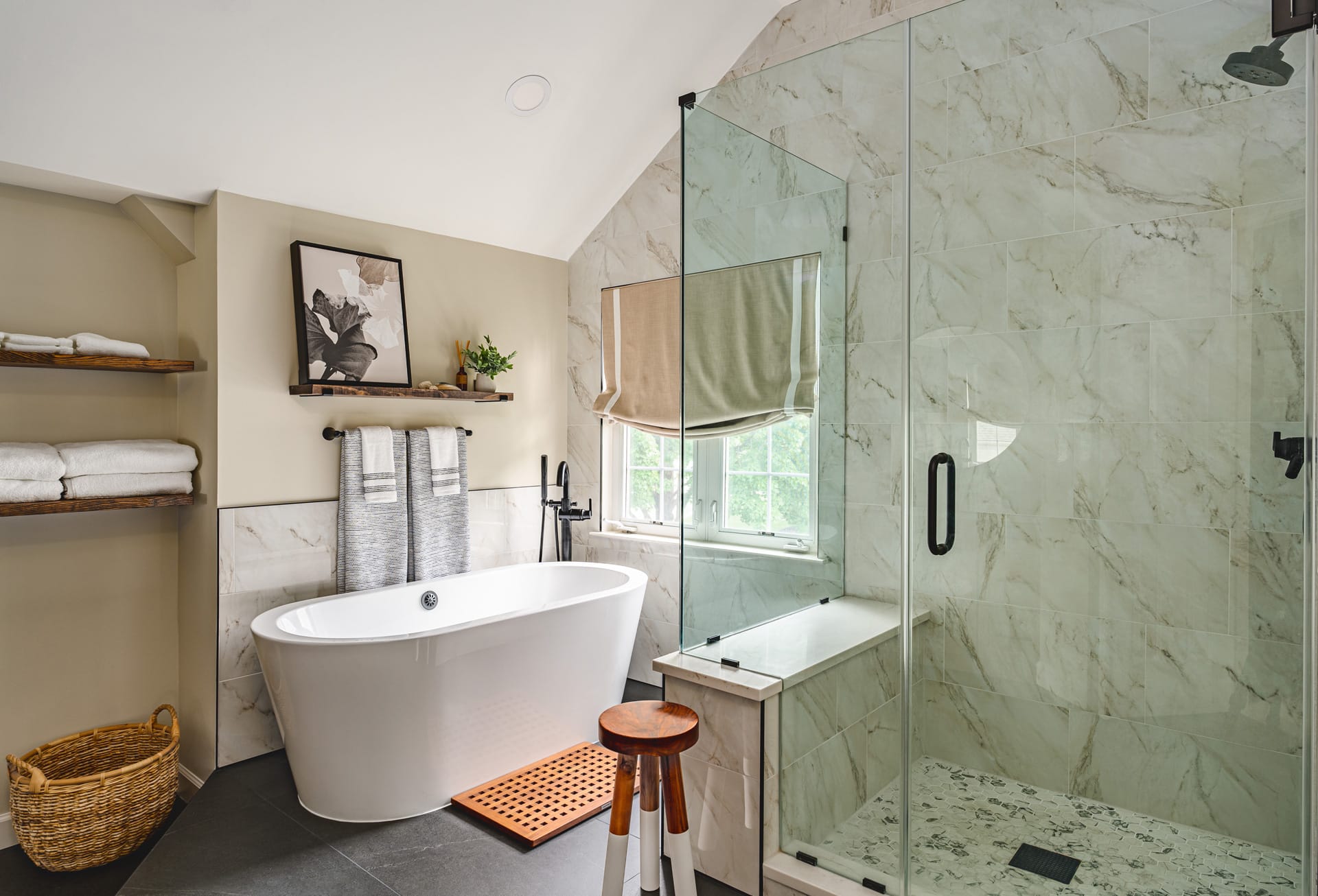 a stylish bathroom featuring a freestanding bathtub, open shelving, and a frameless shower door with elegant marble tile walls. | ACE DECOR