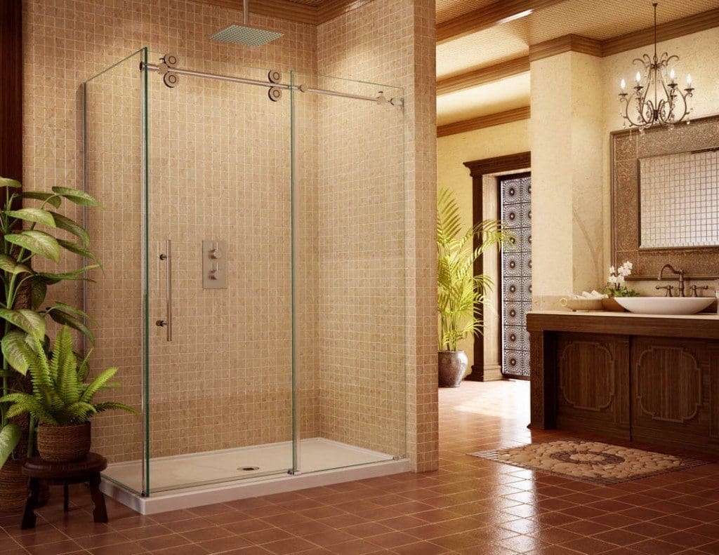 a modern bathroom with a sliding shower door, featuring a glass enclosure, stone tile walls, and elegant decor. | ACE DECOR