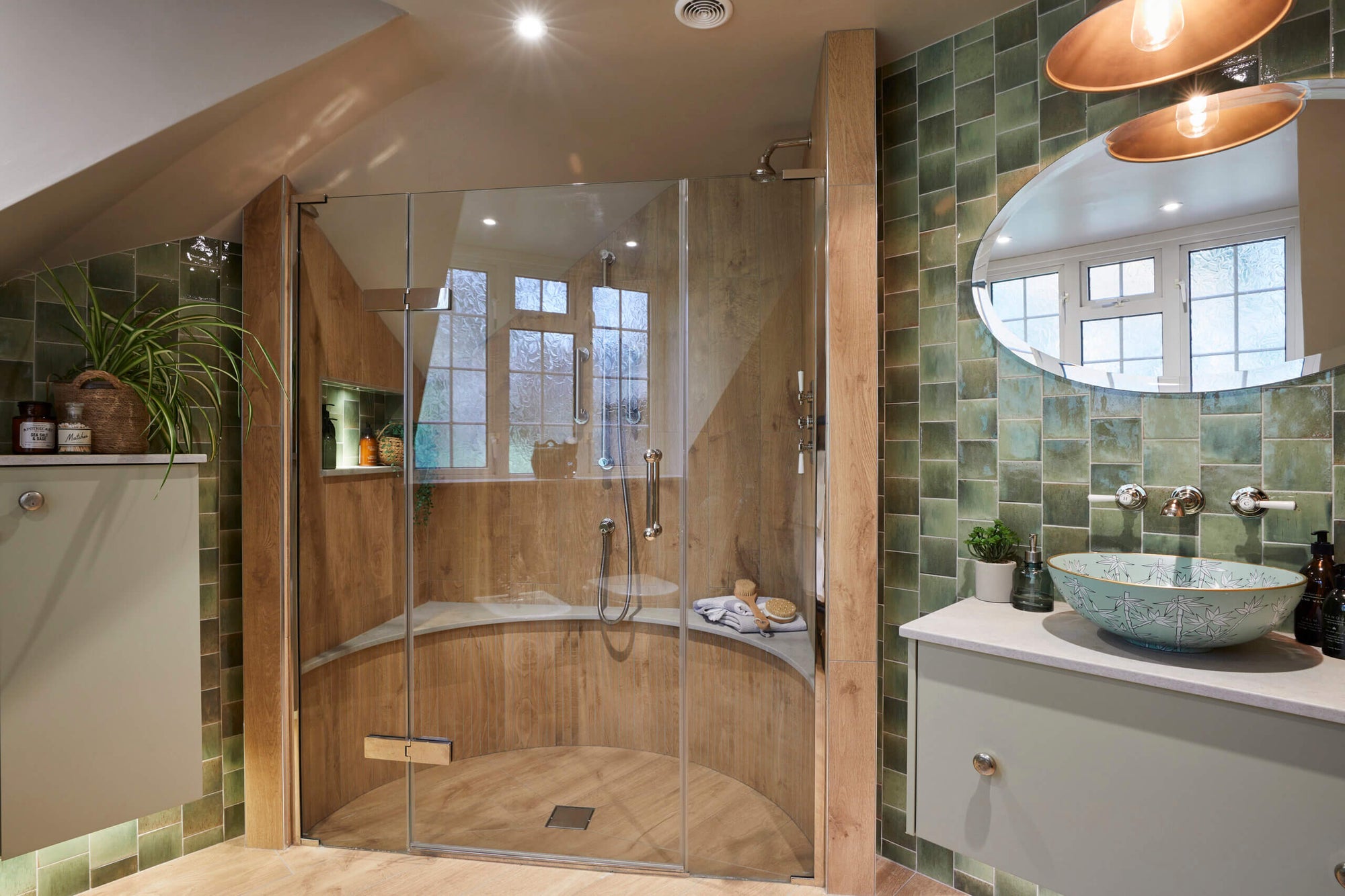 a stylish bathroom featuring a shower glass pivot door, wood-accented walls, green tiled decor, and a modern vessel sink. | ACE DECOR