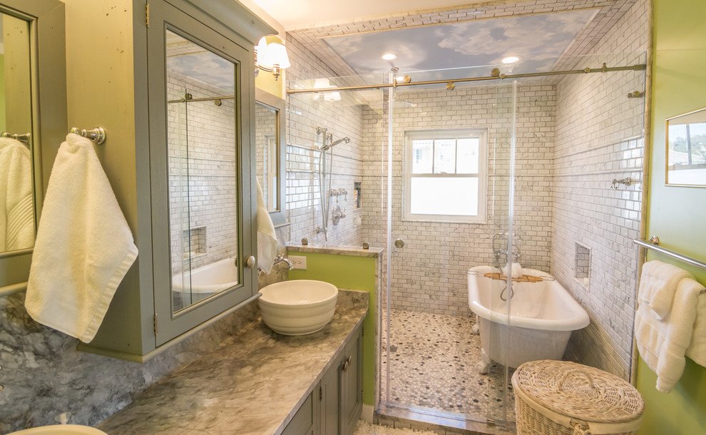 a bathroom featuring a clawfoot tub with a shower glass enclosure, showcasing a stylish and functional design. | ACE DECOR
