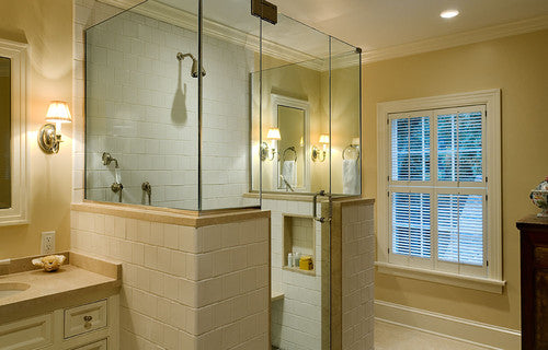 a classic bathroom with a semi frameless shower door, combining glass panels and minimal framing for a clean, elegant look. | ACE DECOR